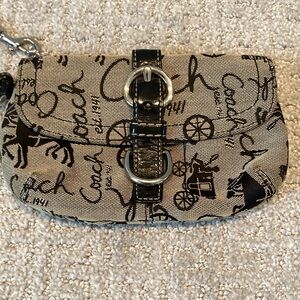 Rare Black Vintage Coach Wristlet/Pouch. It has the horse and carriage design.